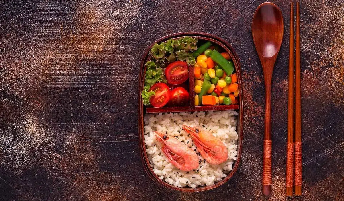 Bento lunchbox with shrimp and veggies for a fresh takeout lunch