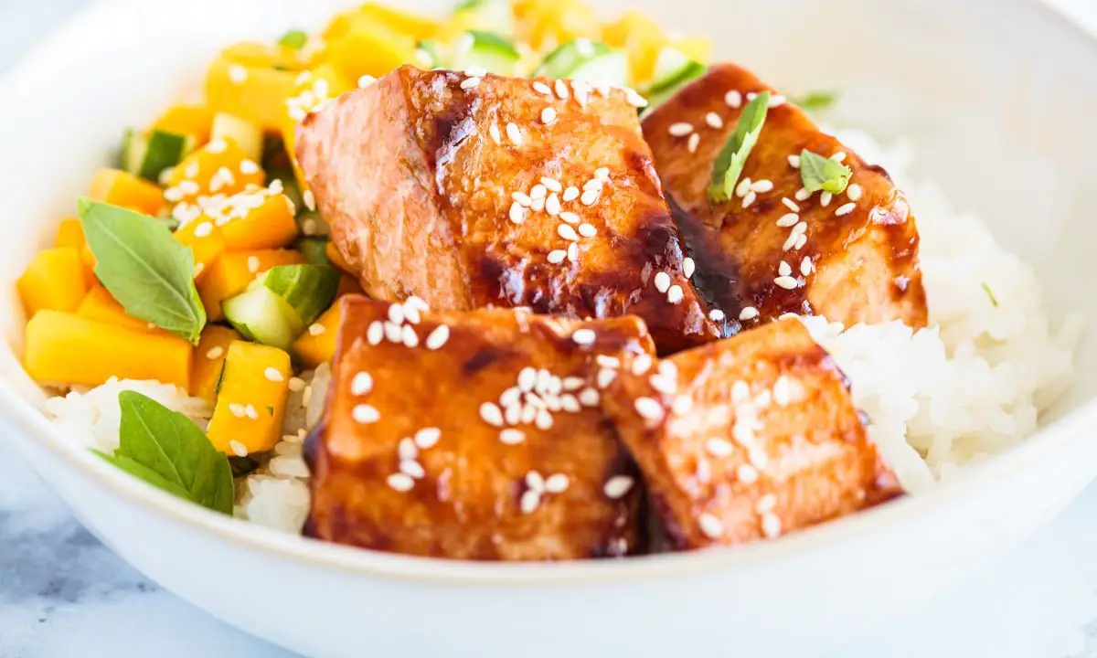 Air-fryer teriyaki salmon cubes on rice with sesame and diced fruit