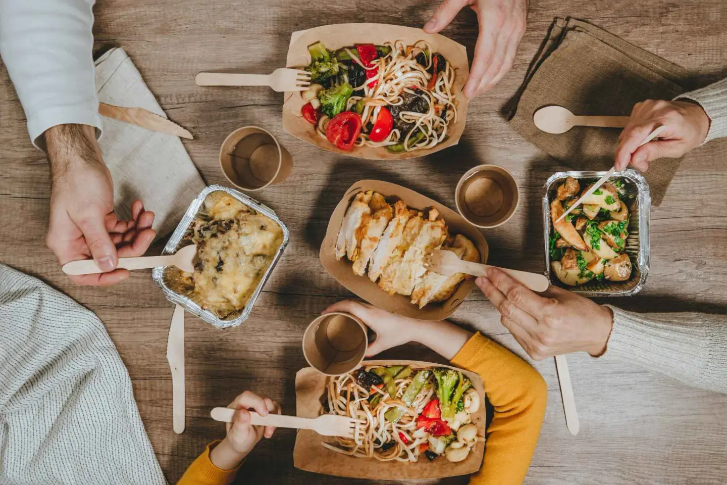 Sakura Teriyaki takeout bowls with chicken, tofu, noodles, and veggies