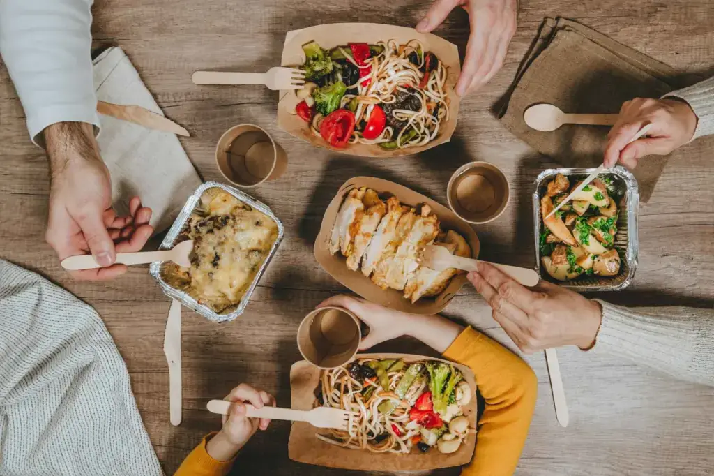 Sakura Teriyaki takeout bowls with chicken, tofu, noodles, and veggies